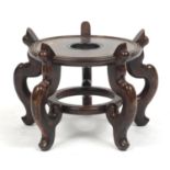 Large Chinese carved hardwood stand, 29cm high x approximately 41cm in diameter