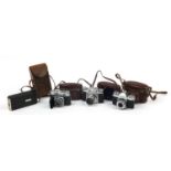 Four vintage cameras including Voiglander Prominent, Kodak Retina II and Zeiss Ikon Contaflex