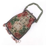 1930's beadwork flapper bag, decorated with stylised flowers, 22cm high excluding the tassels