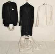 A small group of vintage clothing to include a gentleman's evening tail suit jacket and matching