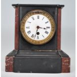 A 19th Century French slate 24 hour mantel clock having a white enamel face with roman numeral