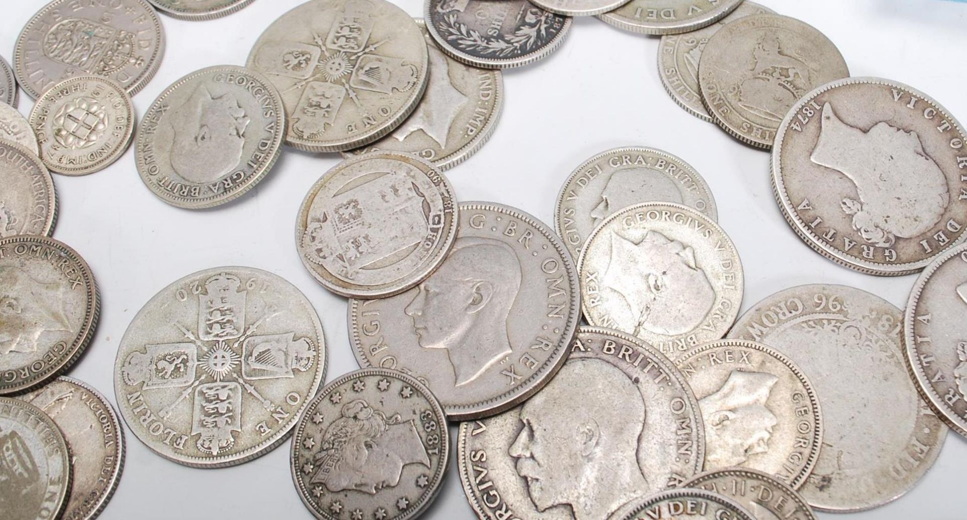 A collection of coins dating from the 19th Century to include pre 1920 silver shillings and florins, - Bild 9 aus 11