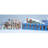 A collection of 1980's football figures to include boxed Corinthian ProStars and a loose figures;