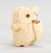 A 20th Century novelty bone tape measure in the form of an owl having a carved mouse to the end of