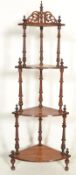 A Victorian mahogany inlaid corner whatnot - etargere raised on turned supports with wedge shaped
