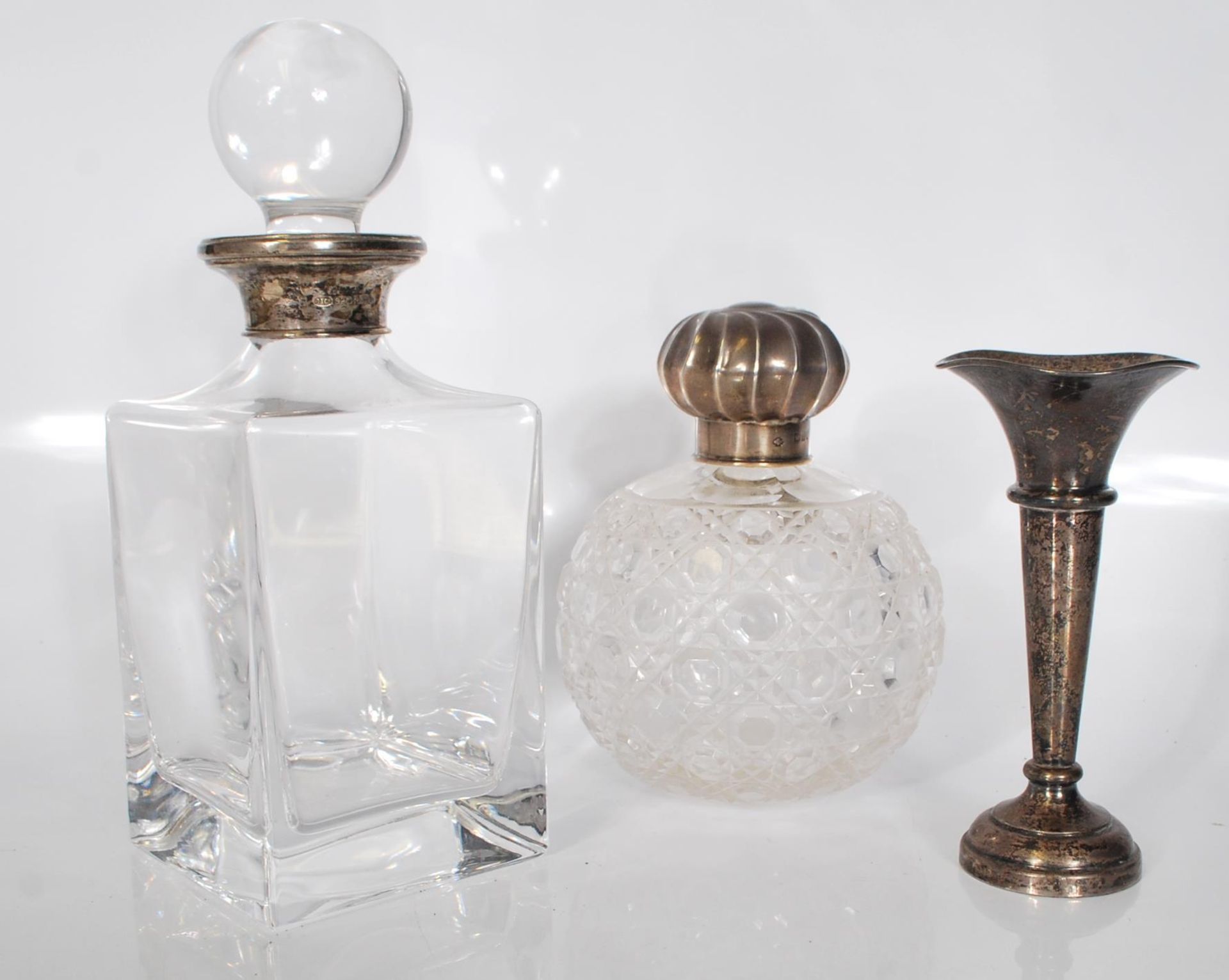 A group of three silver items to include a glass a