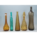 A collection of retro vintage coloured glass bottl