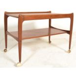 A stunning 1960's retro vintage teak wood two tier drinks / serving / cocktail trolley having shaped
