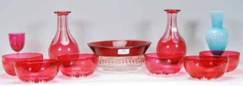 A collection of 19th Century cranberry glass to include six finger bowls having cut glass bases, two