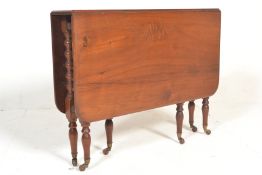 A late Victorian mahogany inlaid Sutherland side table with gate leg action raised on bobbin