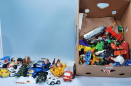 A large collection of vintage diecast toy vehicles and other mixed toys / figures to include