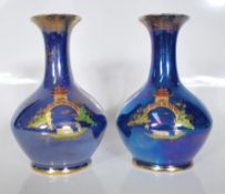 A matching pair of early 20th Century Carlton Ware blue lustre glaze vases, with gilded Japanese