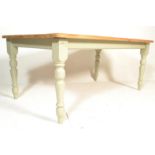 A large 20th Century contemporary pine scrub topped farmhouse dining table, flared top over block