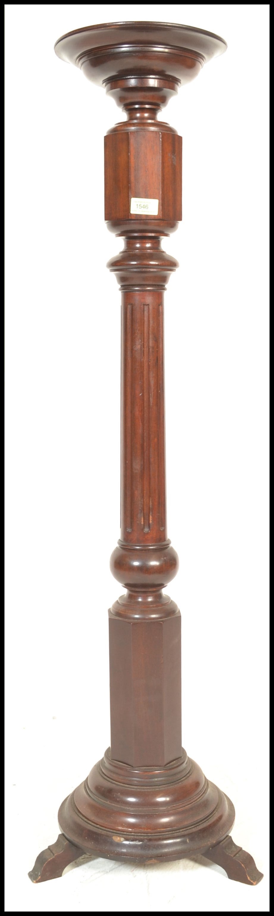 A 19th Century mahogany torchere plant stand havin