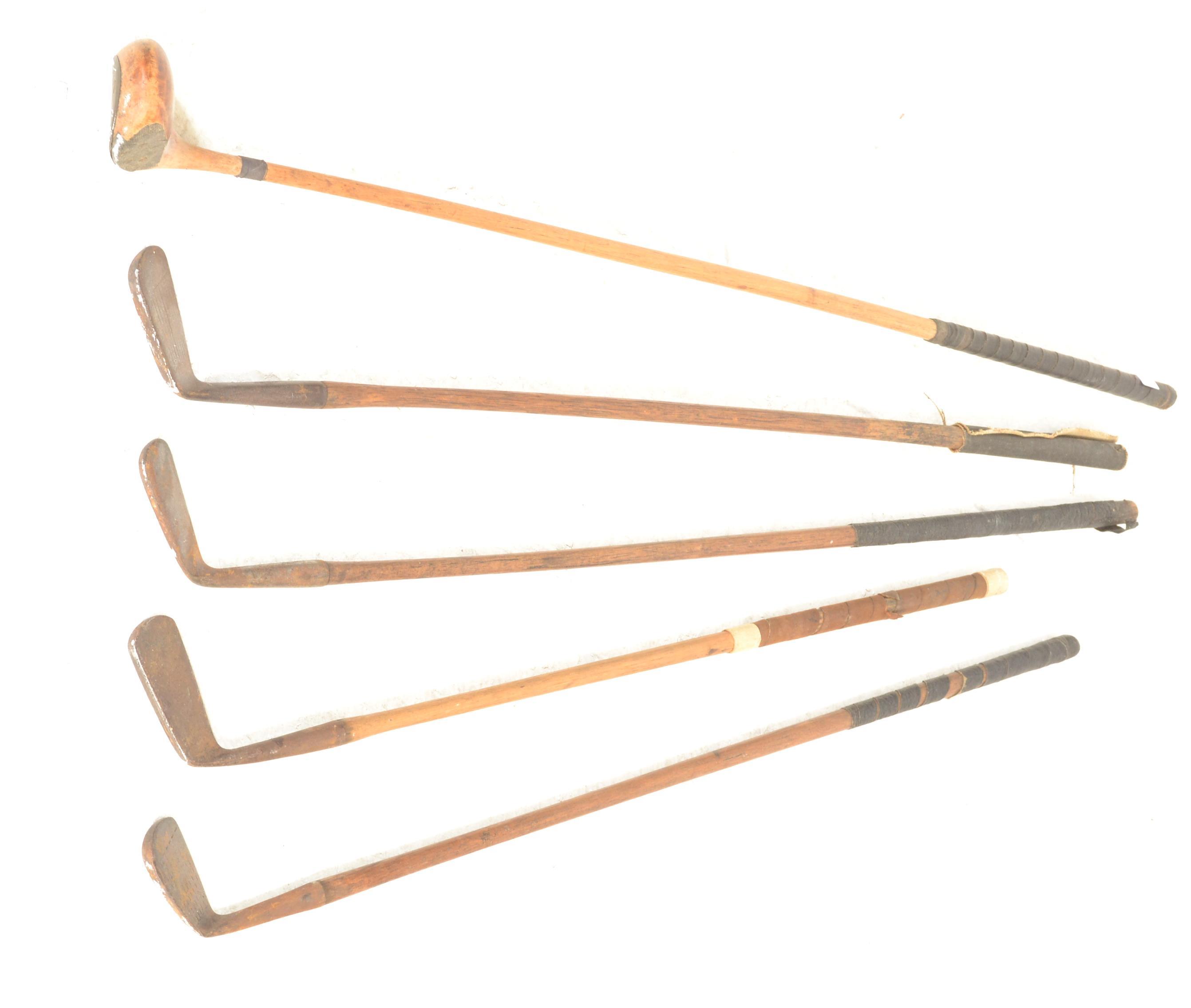 A group of early 20th Century golf clubs having wooden shafts with cast metal heads to include irons - Image 2 of 5