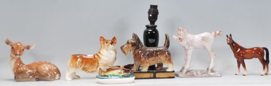 A collection of ceramic animal figurines to include a Beswick dog, a lustre fish ashtray, Scottie