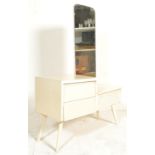 A retro mid century painted dressing table having tapering angled legs supporting a bee hive fronted