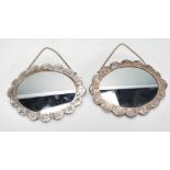 A pair of 20th Century 900 silver small wall hanging / dressing table mirrors of oval form, silver