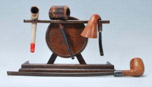 A selection of early 20th Century smoking pipes to