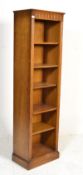 A large oak upright bookcase cabinet in  the manner of Jaycee / Old Charm being raised on a plinth