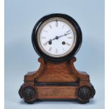 A late 19th Century French walnut cased mantel clock, fitted with barrel movement, the white