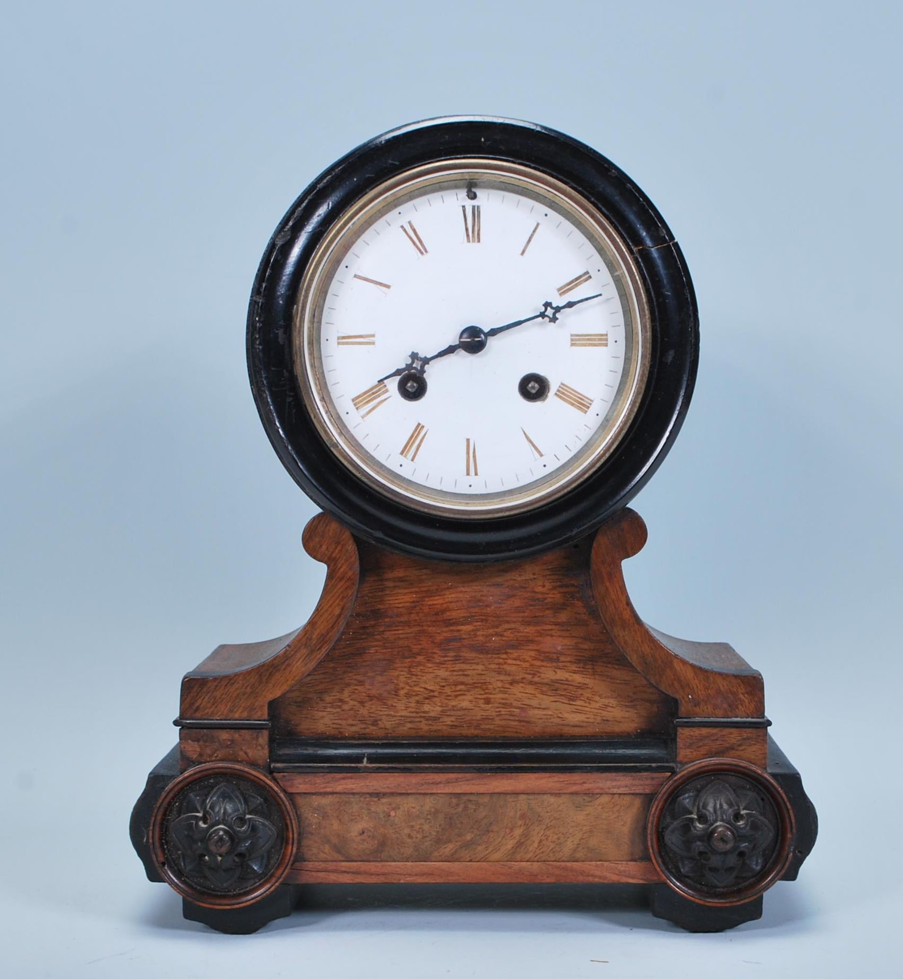 A late 19th Century French walnut cased mantel clock, fitted with barrel movement, the white