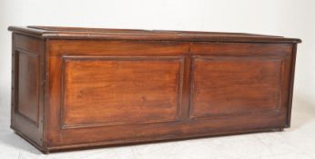 A late 19th century large mahogany ottoman chest - blanket box with fielded panels to the front,
