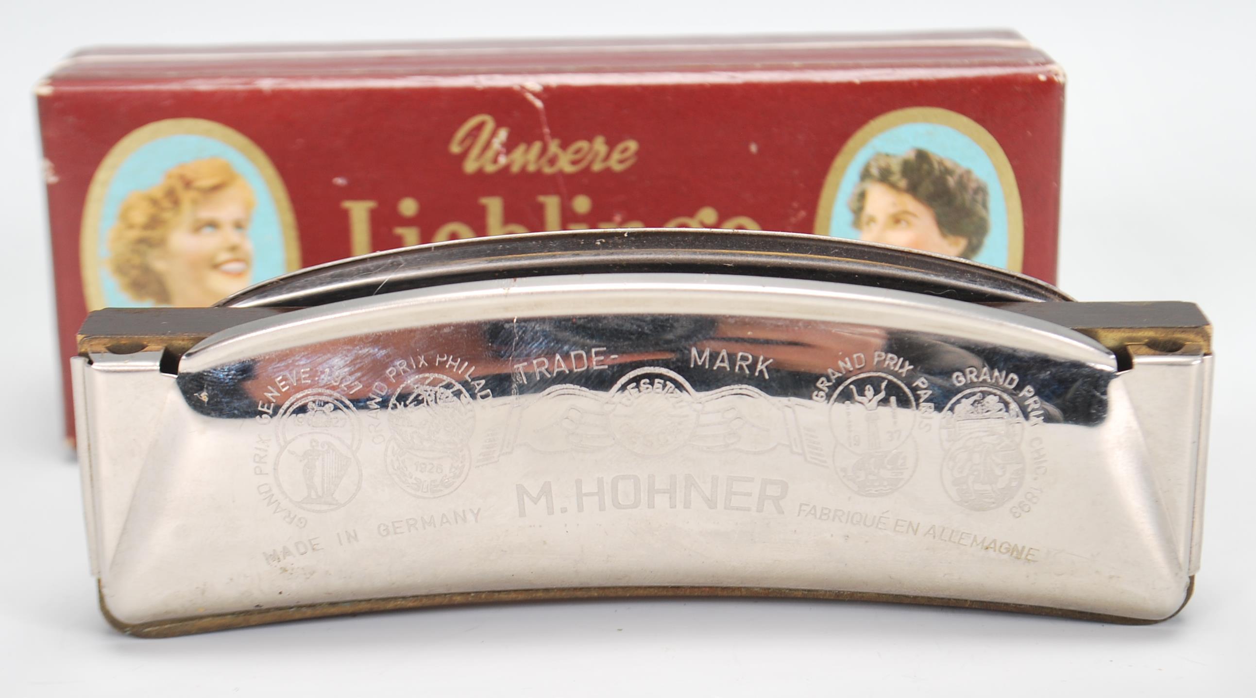 A vintage early 20th Century Unsere Lieblinge M. Hohner harmonica / mouth organ in original box. - Image 6 of 6