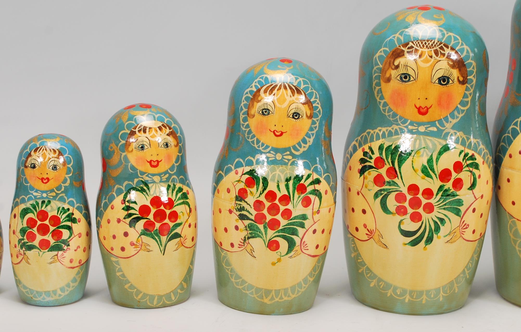 A collection of Russian ornaments to include a large set of russian dolls beung hand painted with - Image 8 of 9