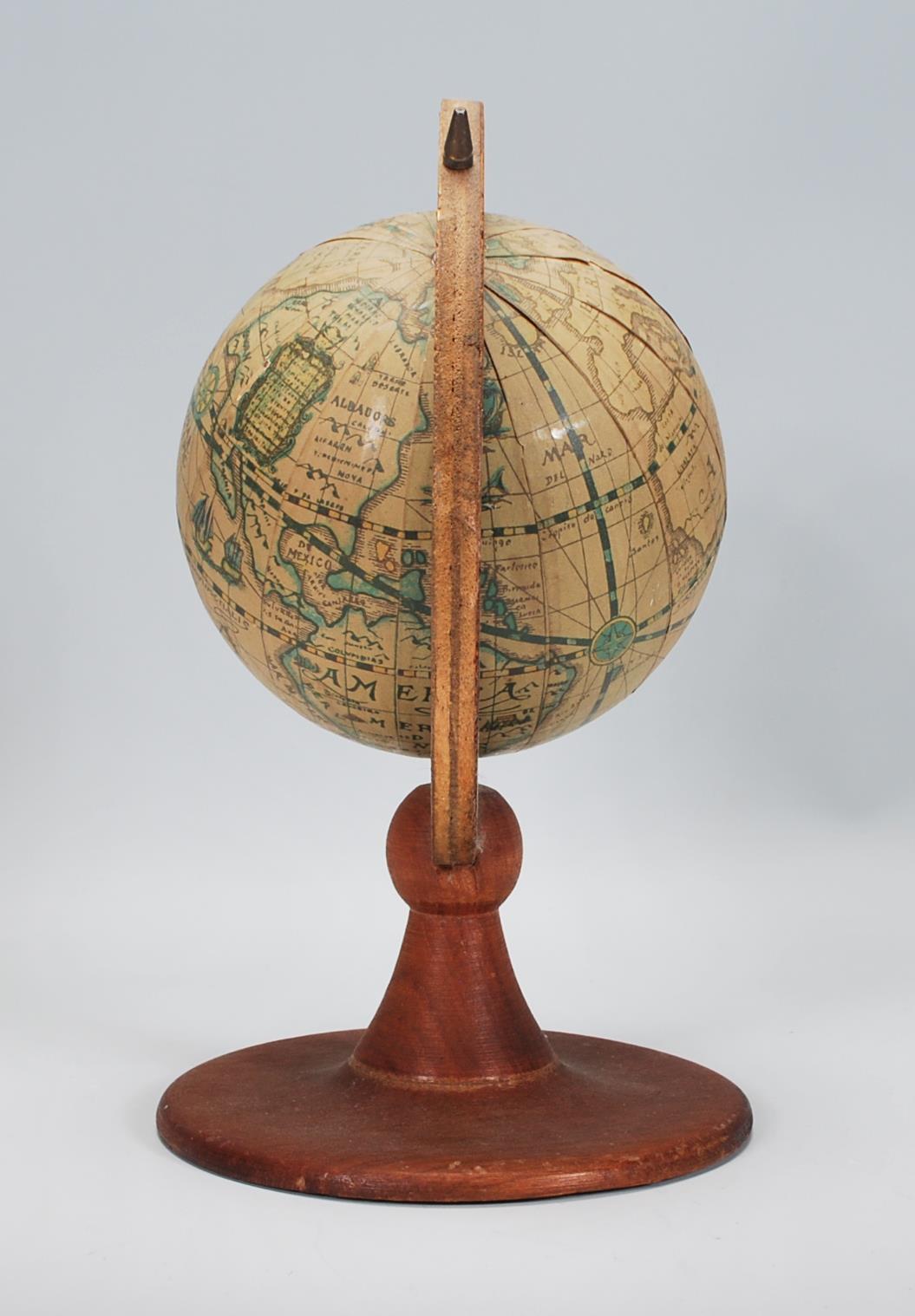 A antique style vintage desk top globe raised on a round wooden base with globe above set within a - Image 2 of 5