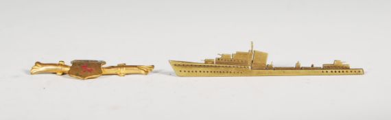 A vintage 20th Century brass sweetheart brooch in the form of a naval frigate having pin clasp to