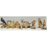 A large collection of Italian ceramic / Capodimonte style bird figurines to include a Viertasca bird