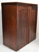 A vintage early 20th Century converted mahogany linen press top having paneled doors concealing a