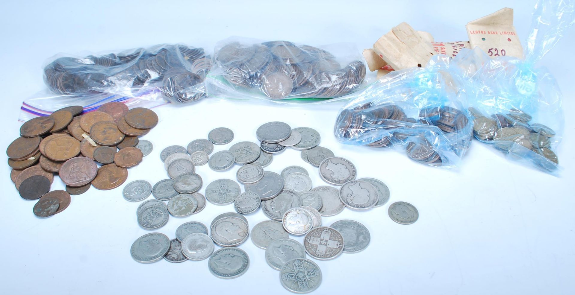 A collection of coins dating from the 19th Century to include pre 1920 silver shillings and florins,
