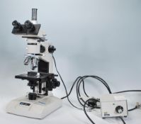 A vintage 20th Century scientific Meiji Techno laboratory microscope contained with fitted oak