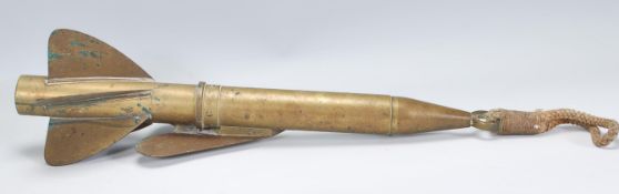 An early 20th Century T Walker's patent brass harpoon ship log of torpedo form having three