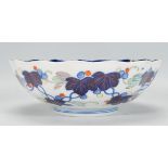 A Chinese blue and white geometric pattern fruit bowl with ironstone red single character mark to