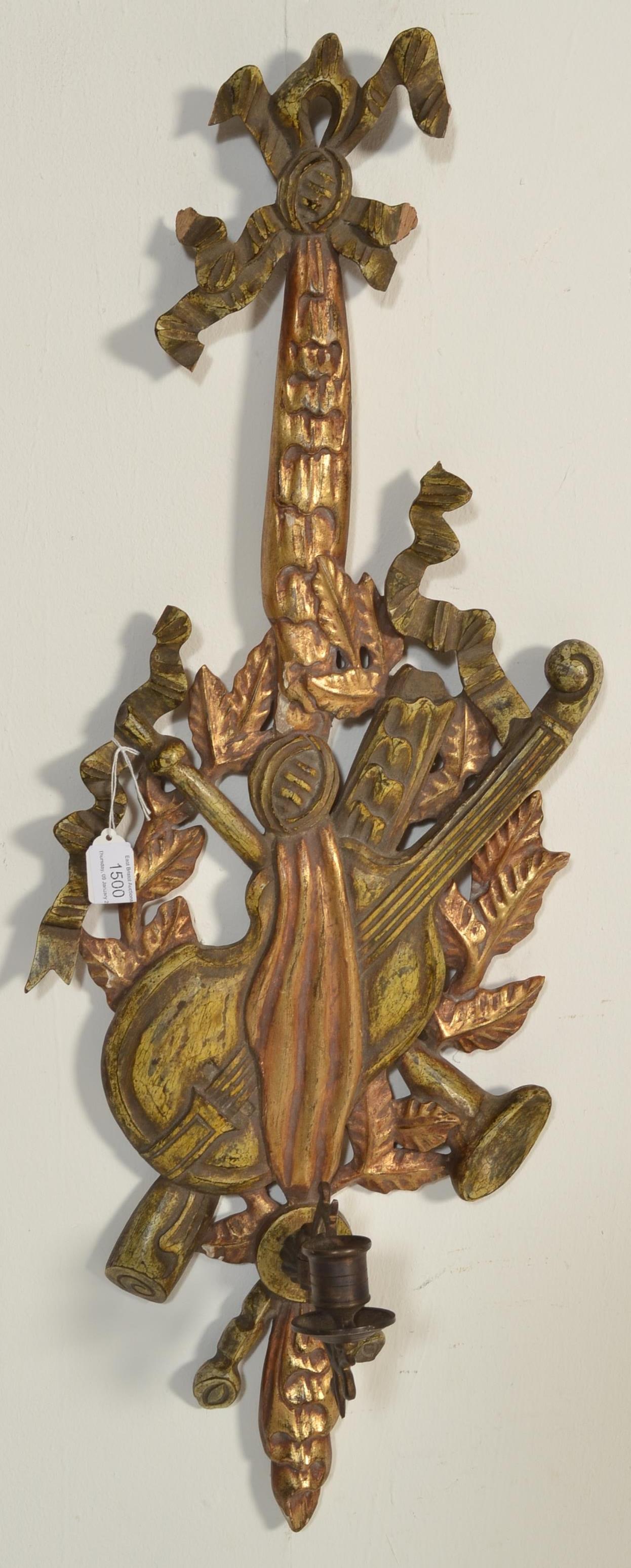 A vintage 20th Century antique style gilt wood wall sconce having carved musical instruments