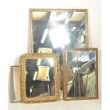 A group of contemporary antique style wall mirrors, each with gilt frames and of varying sizes.