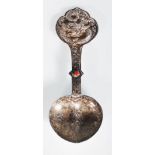 A late 19th / early 20th Century Chinese silver spoon having repousse dragon decorated handle with