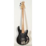 A 20th Century Westfield made electric bass guitar having black body with black pick guard and