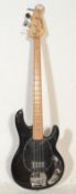 A 20th Century Westfield made electric bass guitar having black body with black pick guard and