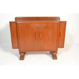 A 1930's Art Deco Ernst Gomme for G Plan oak cocktail cabinet sideboard credenza. The gallery back