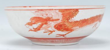 A 19th Century Japanese Kutani footed centrepiece bowl having hand painted decoration in red and