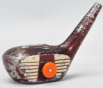 A vintage 20th Century table lighter in the form of a golf club head having push button side.