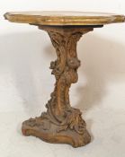 A 20th century Italian faux marble carved wooden centre / lamp table. The wooden base gilded and