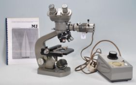 An Olympus Optical Company Ltd, metallurgical microscope, model MJ fitted K20X eyepieces. Together