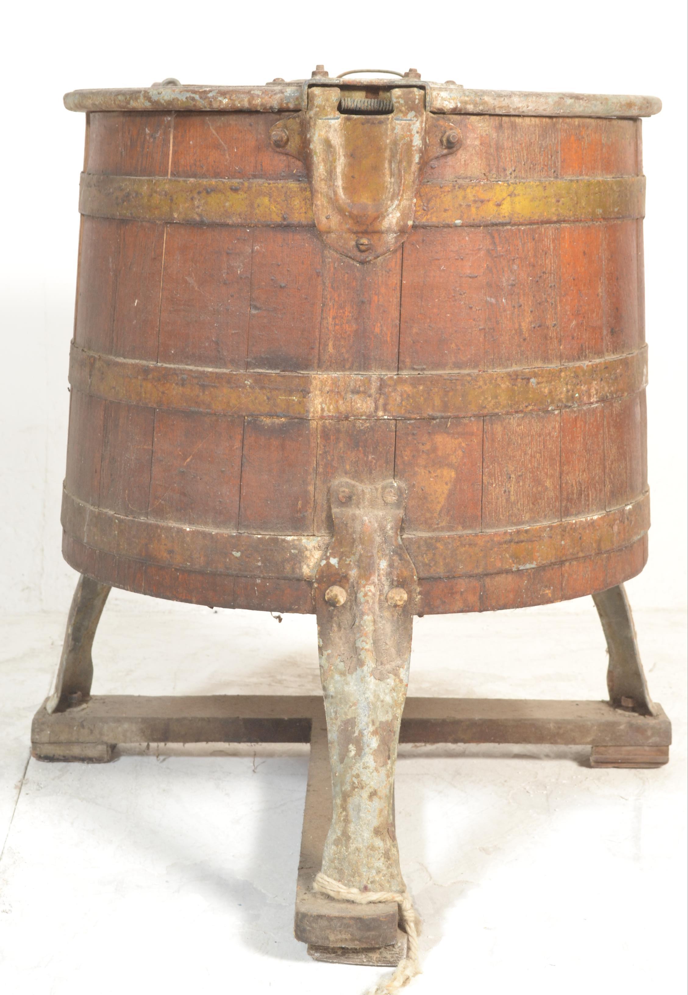 A 19th century coopered oak barrel washing / machine. The oak sectional barrel with coopered