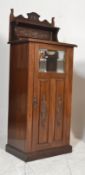 A Victorian 19th century mahogany Arts & Crafts upright pedestal music cabinet. Raised on a plinth