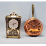 A vintage 20th Century Schatz anniversary clock having a round white face with gilt roman numerals